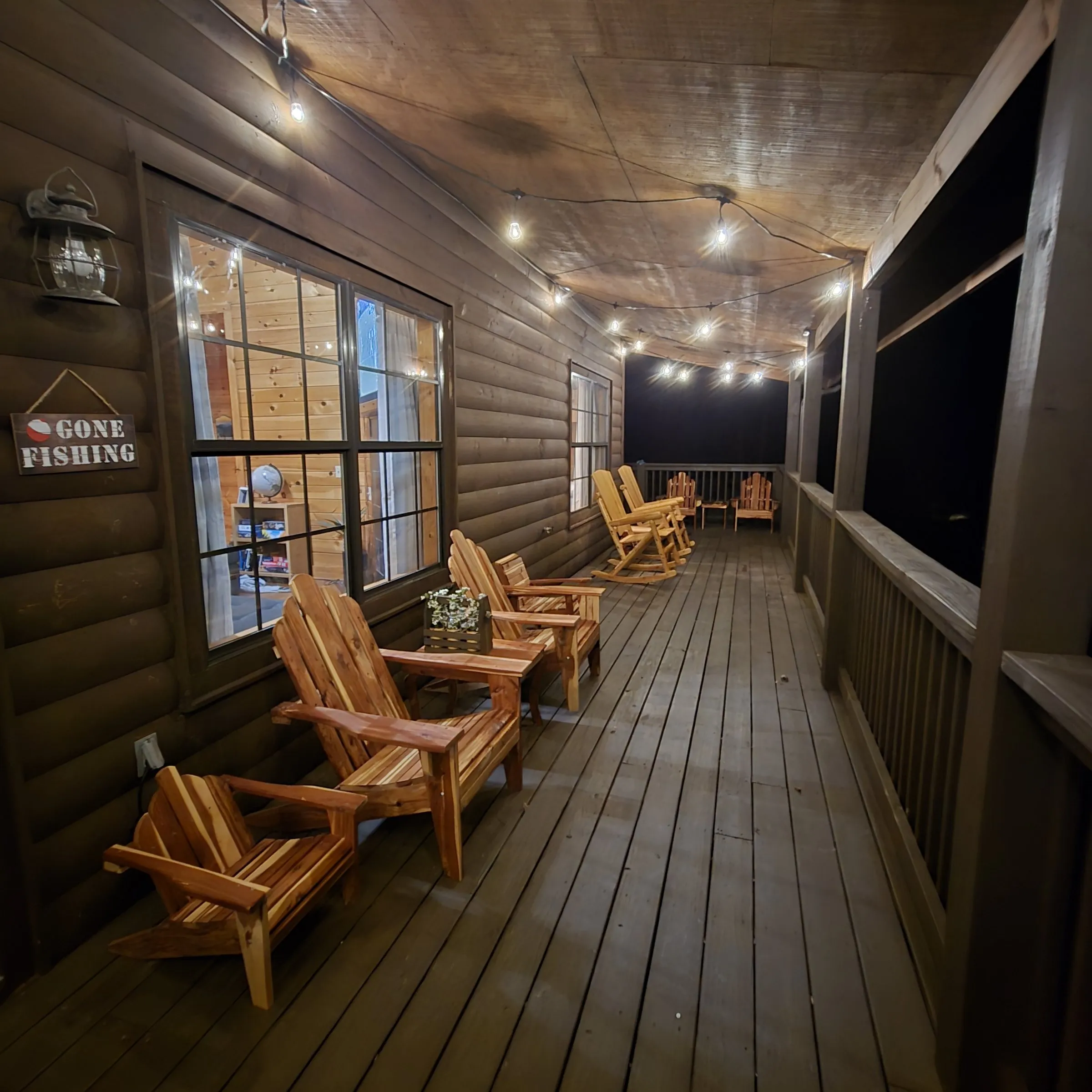 A finished section of the cabin deck, lit at night, Sevierville, TN
