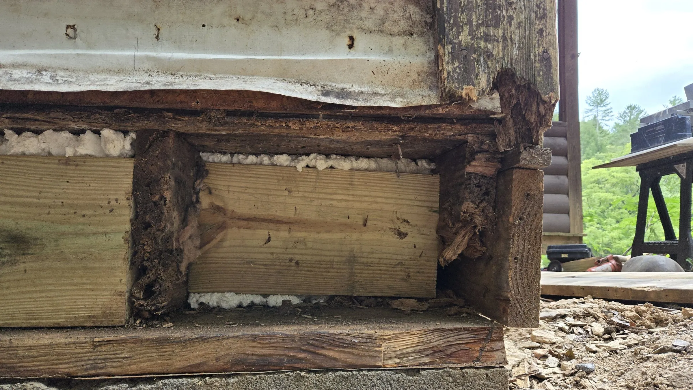 Rotted rim board where the deck meets the cabin wall