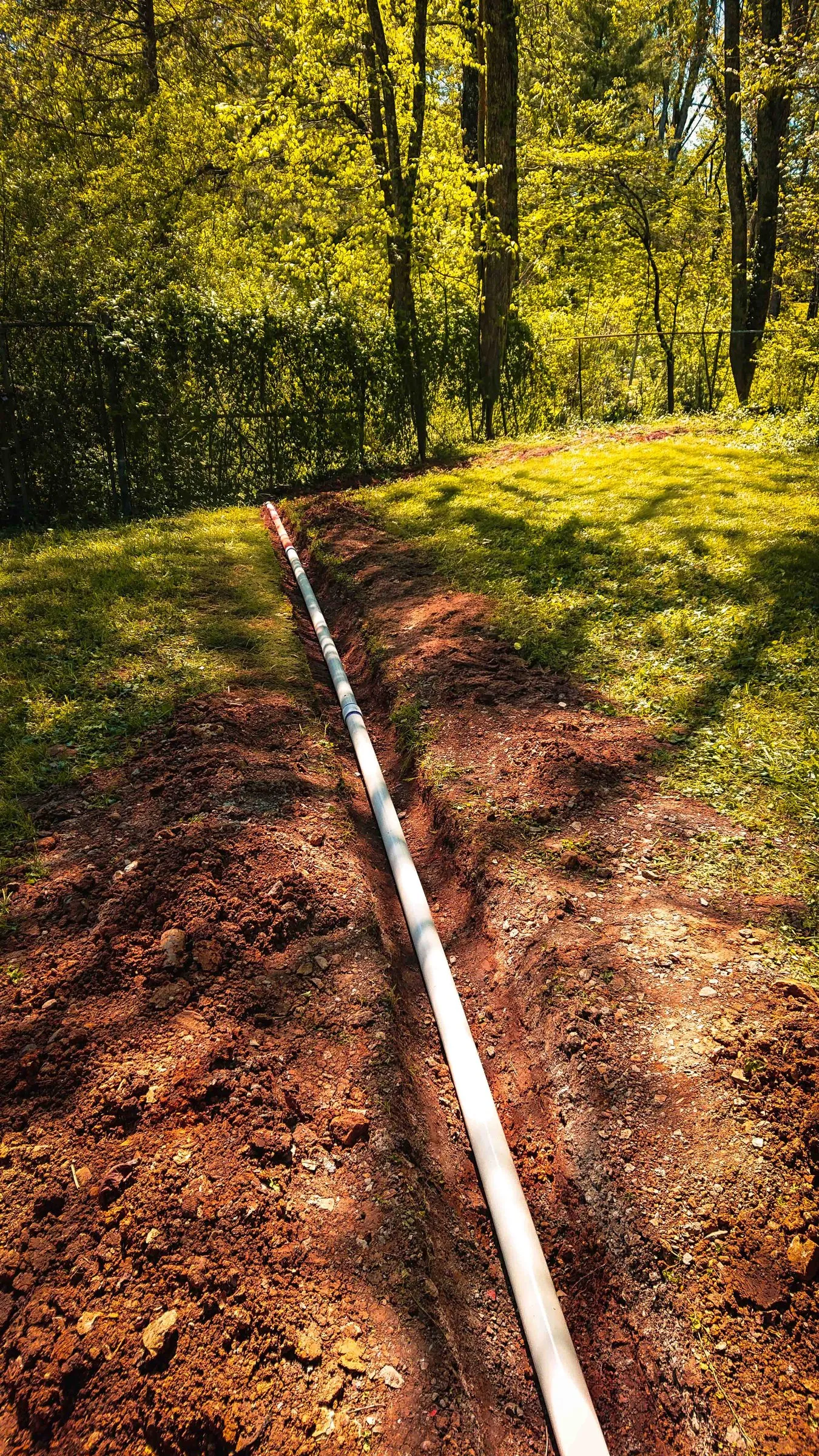 Pool drain line laid in the trench, before backfill, Oak Ridge, TN